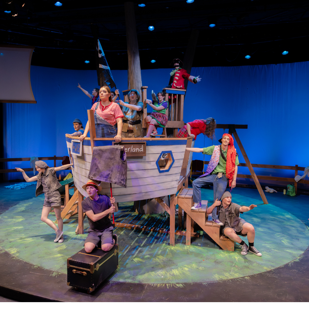 Theater set with boat and actors
