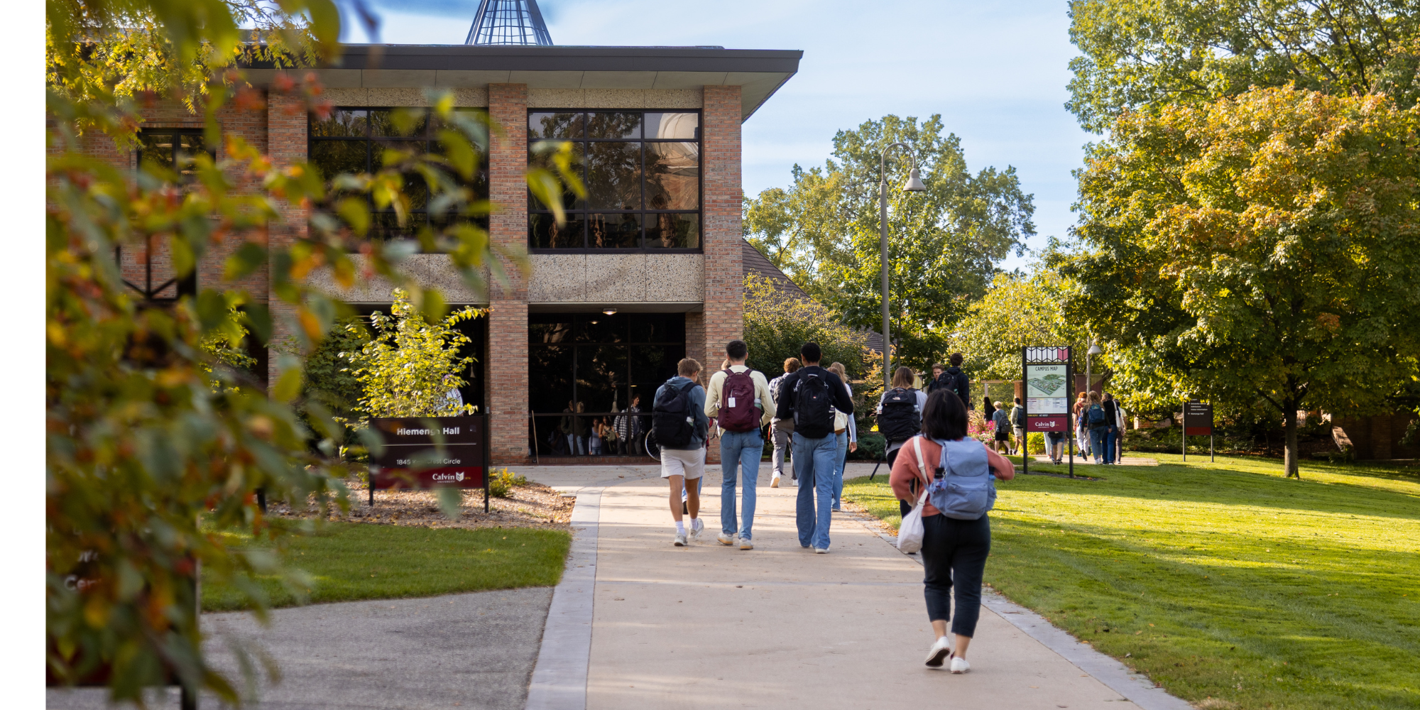 Calvin students walk on the path in Fall 2025