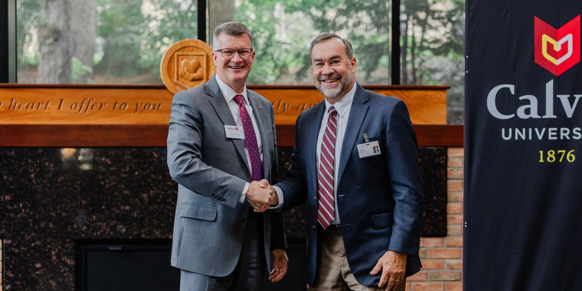 Calvin President Greg Elzinga and Trillium President Troy Vugteveen