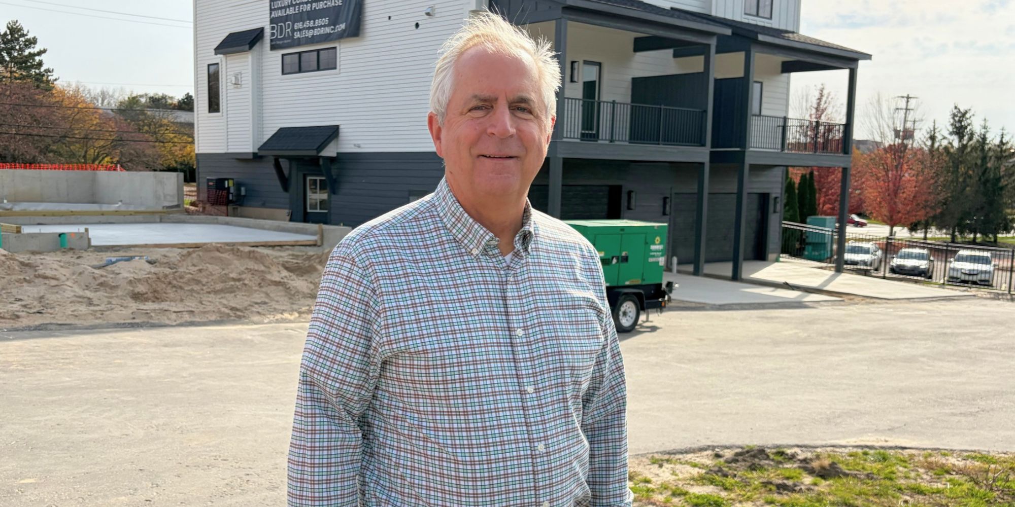 Kevin Einfeld, president of BDR Executive Custom Homes, Inc., standing in front of one of his properties.