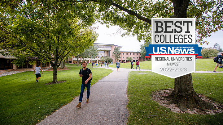 A student walks on a path on Calvin University's park-like campus, a U.S. News badge is overlayed.