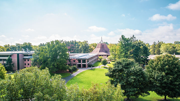 Aerial view of campus, showing trees and buildings