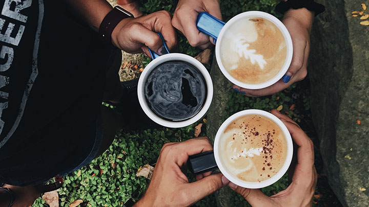 Hands holding coffee