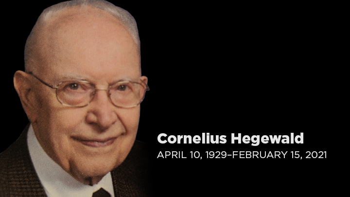 A headshot of an older man with glasses and gray hair with April 10, 1929-February 15, 2021.