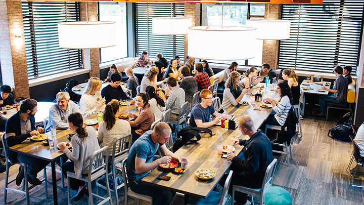 Students gather for a meal at Calvin's newly renovated Commons Dining Hall.