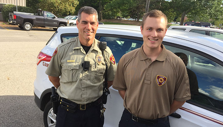 Campus safety patrol supervisor Ron Venneman (left) and Calvin sophomore Josh Kuperus (right).