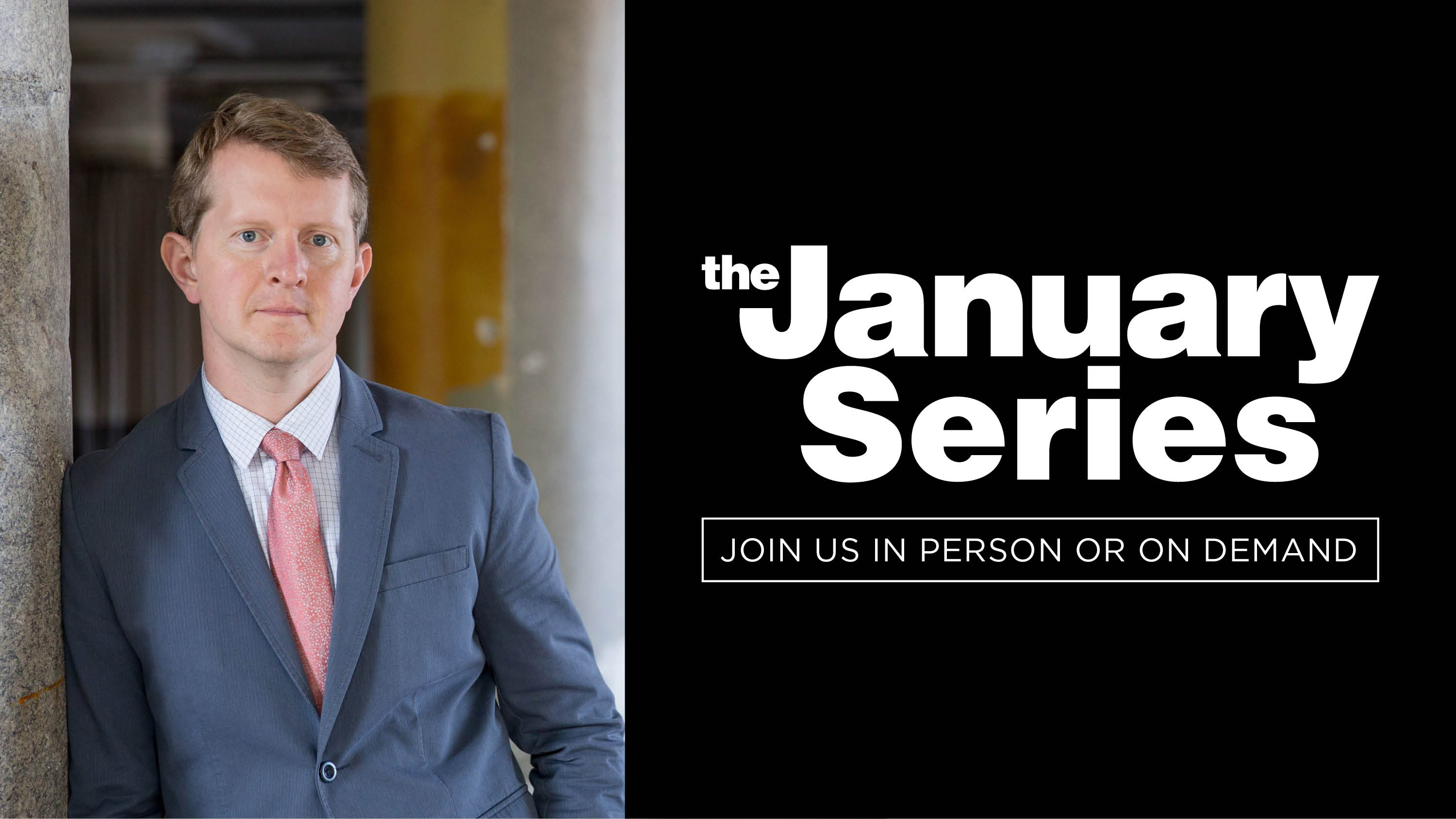 A man in suit and tie leans against a wall (left); the January Series logo (right)