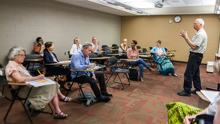 Calvin profs Roland Hoksbergen (economics) and Tracy Kuperus (political science) co-lead a session during the "Take Your Church to College" event. Photo courtesy: Deborah Hoag Photography