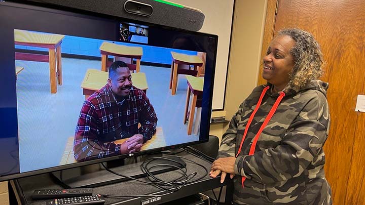 Valmarcus Jones (at Handlon Correctional Facility) and Jerline Riley (on Calvin's campus) talking to one another.