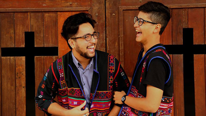 Silas (right) and his brother in traditional Akha (the ethnic tribe of their father) apparel.