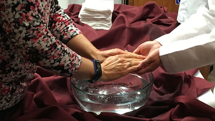 Nursing faculty members washed students’ hands as part of the ceremony.