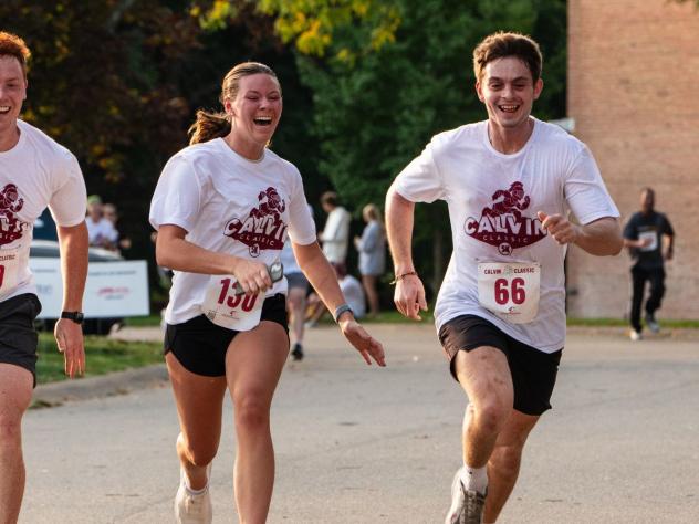 Three students running during the Calvin Classic 5K 