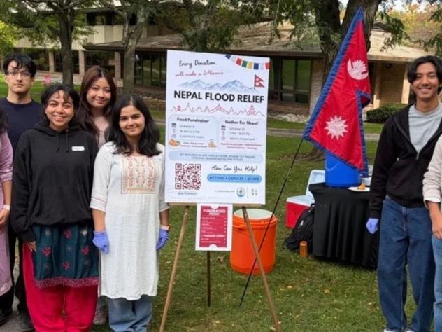 Students from Nepal hold a fundraiser to support those affected by the Nepal floods.