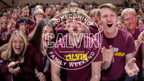 Students cheering with maroon and gold Calvin shirts