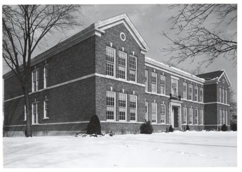 A building with rows of large windows.