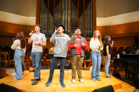 An image of students worshipping