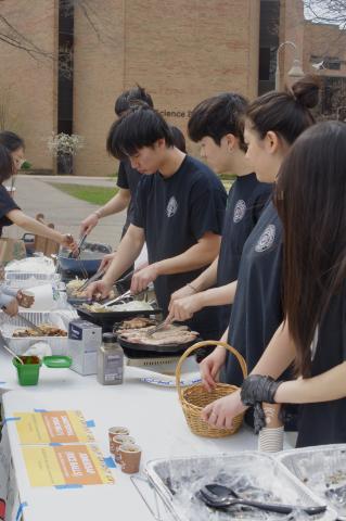 Members of Calvin's Korean Student Association serving food