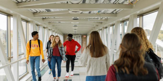 Several Calvin students walking across Calvin Crossings