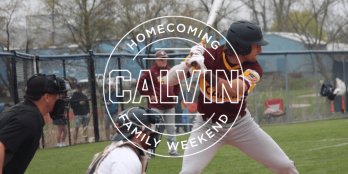 Calvin University baseball player holding a bat