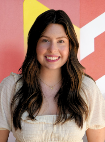 Photo of Abigail Harwood in front of Calvin logo. 