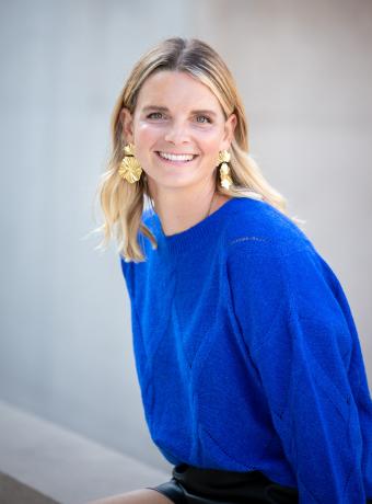 becky bagnall in a blue shirt white background headshot photo