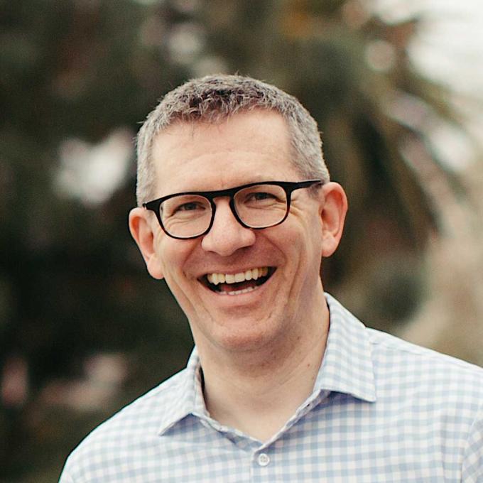 Andy Crouch, with a friendly smile and hands clasped.