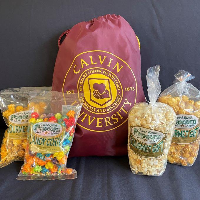 drawstring bag with four bags of popcorn