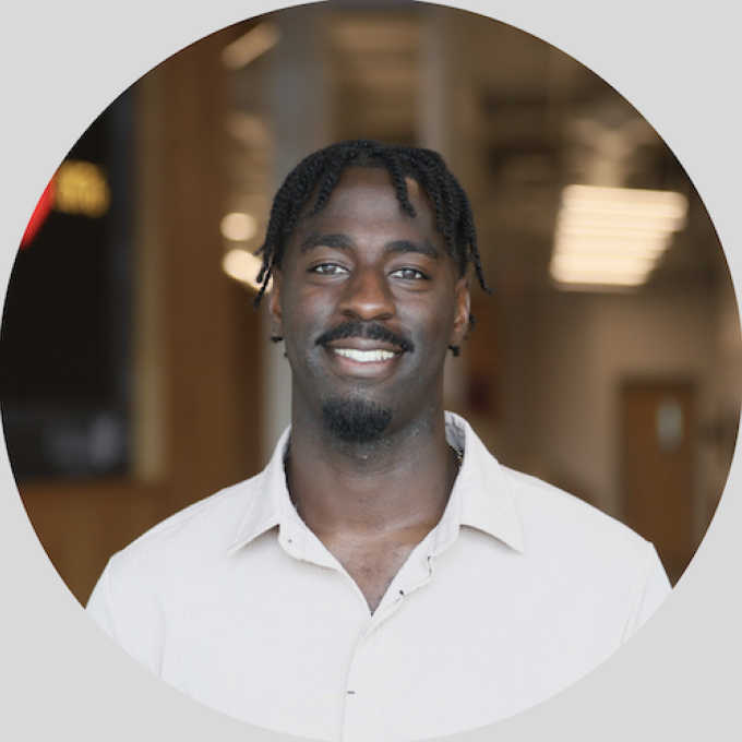 Aguma Muhumuza smiling headshot