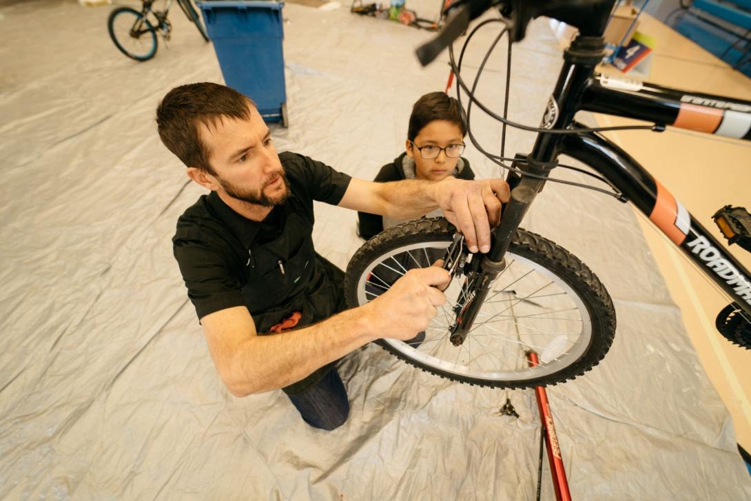 Scott Nydam '99 working on a bike