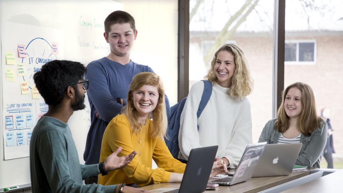 Students gathered around a table