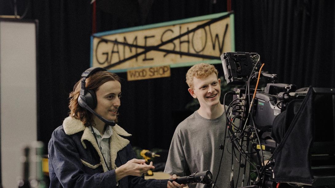 Two students at a film camera