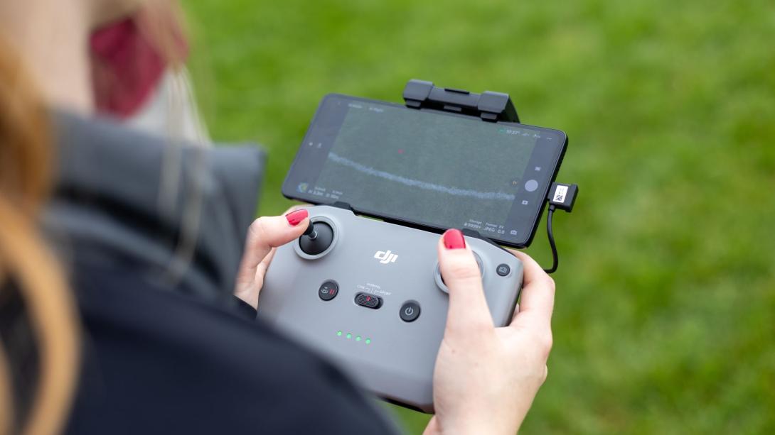 Woman controlling a drone