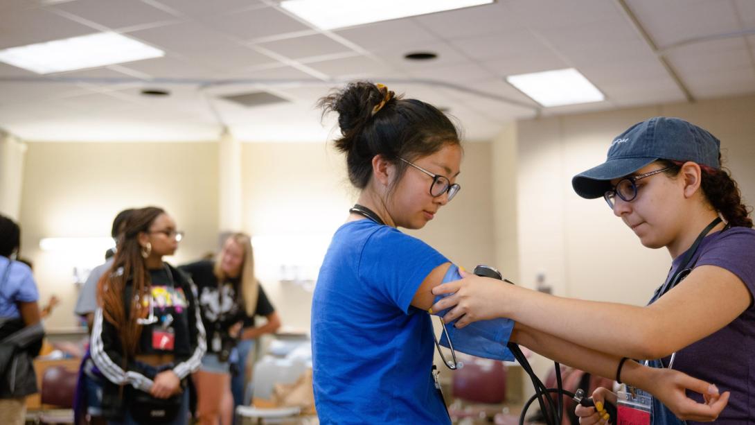 Woman taking blood pressure