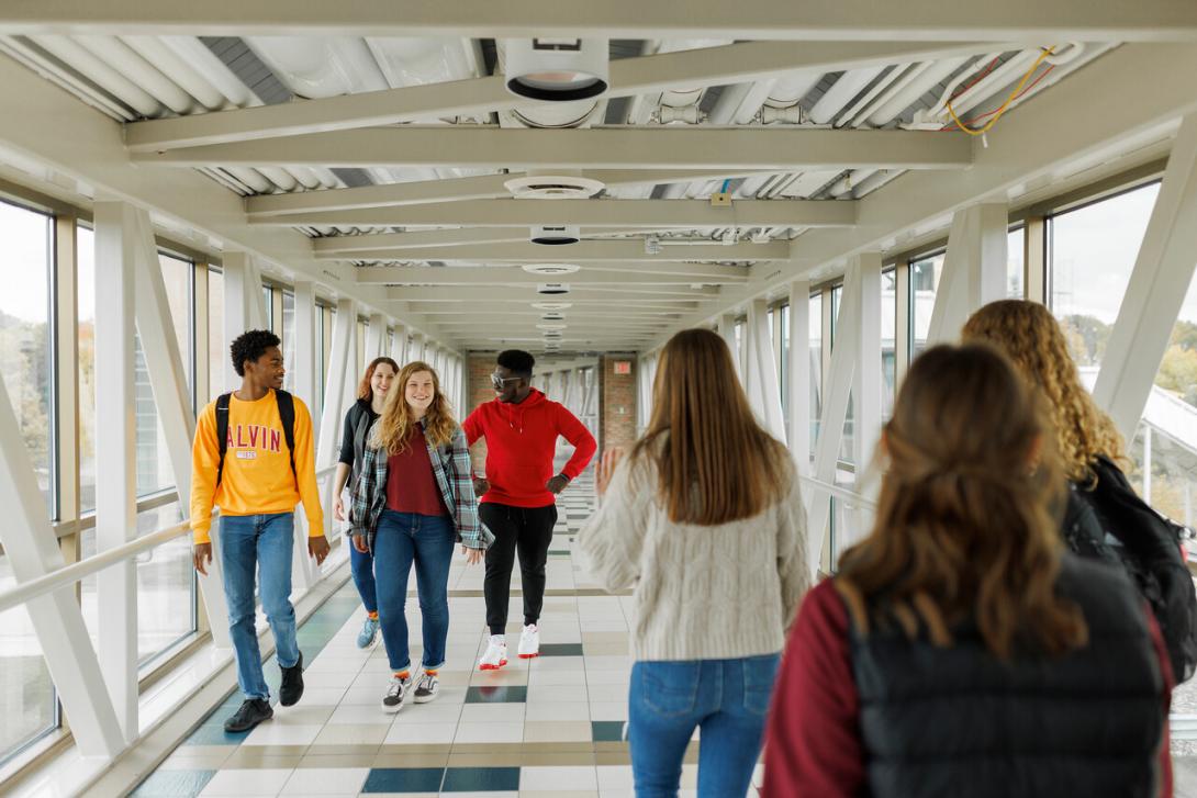 Several Calvin students walking across Calvin Crossings