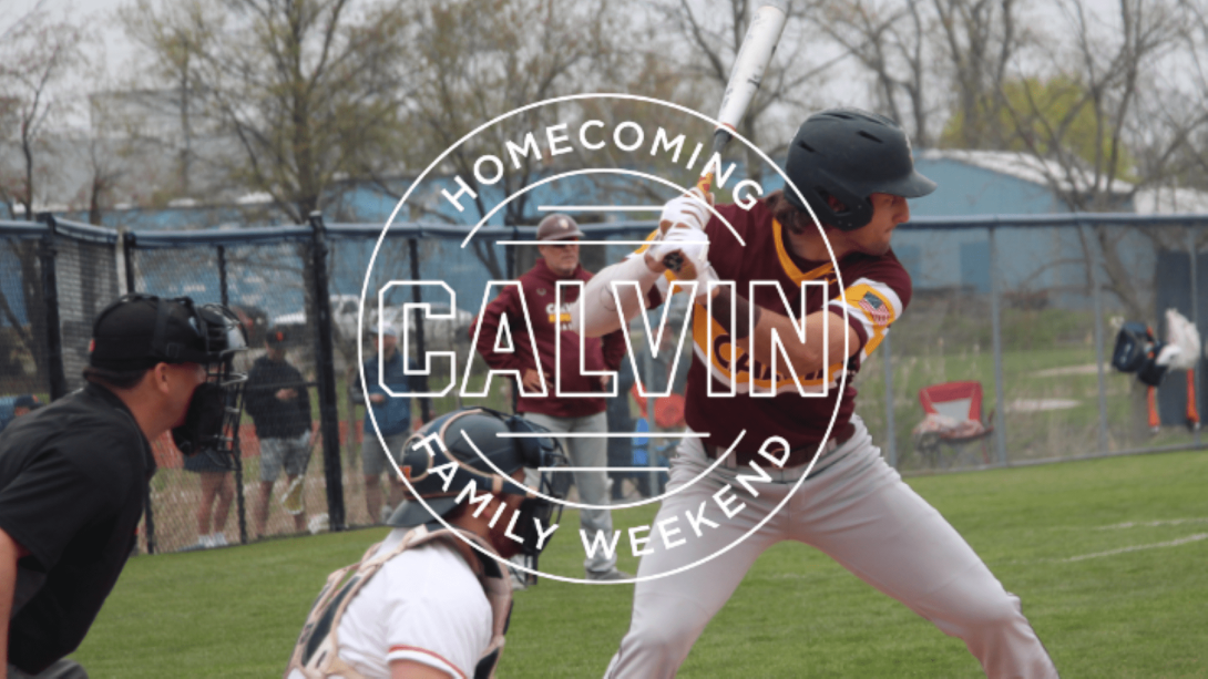 Calvin University baseball player holding a bat