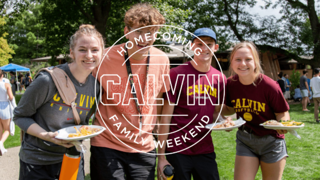 Students eating cookout food on Commons Lawn