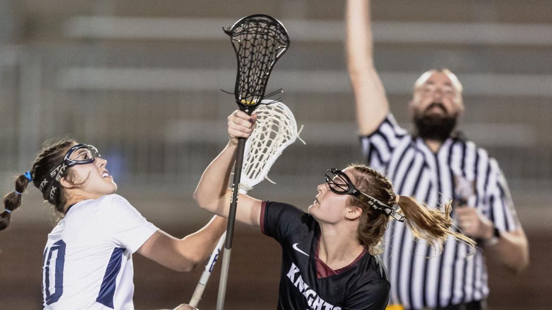 Two lacrosse players