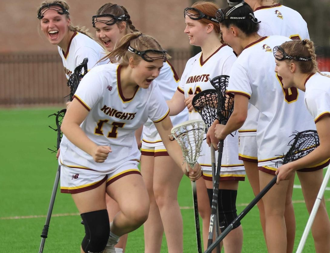 Women's lacrosse players congratulating each other