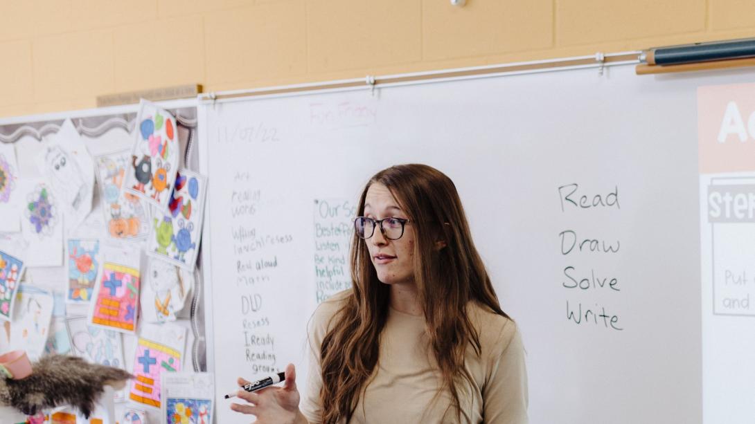 Teacher at a whiteboard