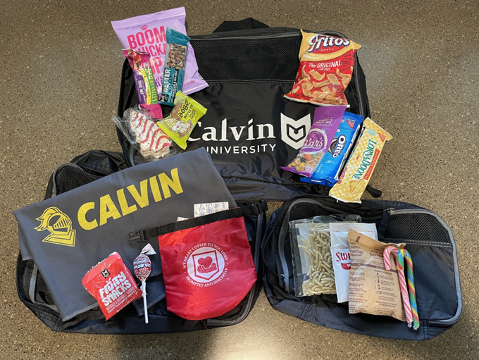 Care package with travel pouches and snacks