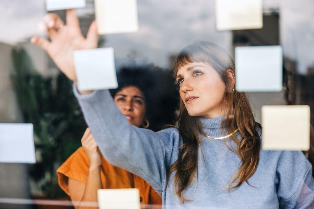 Woman working with sticky notes