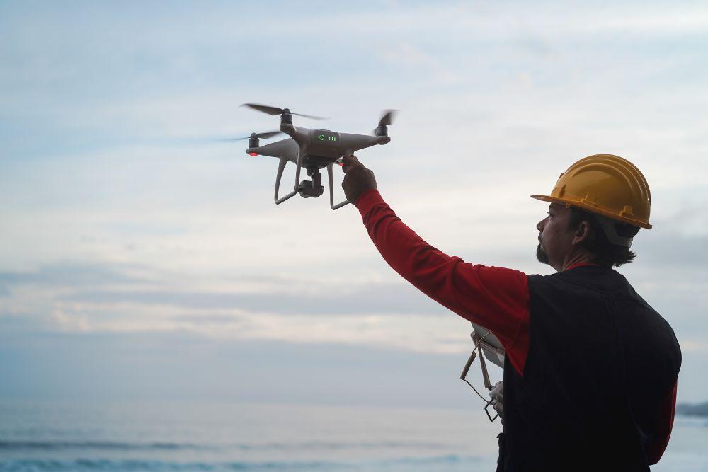 Man operating a drone