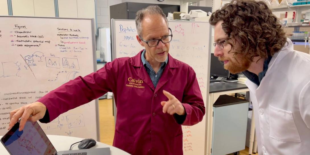 Professor David Benson researching alongside Cory Guikema, a junior biochemistry and engineering double major.