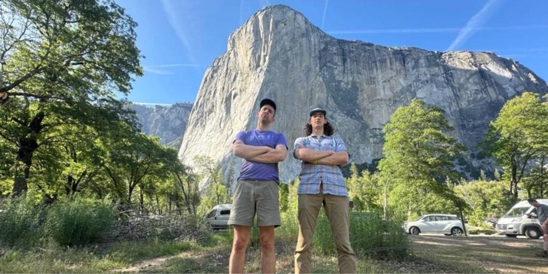 Kyle Heys and a Calvin alum standing with arms crossed and El Capitan in the background.