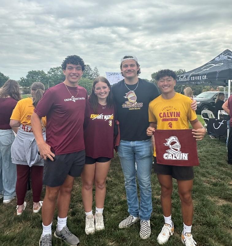 Students wearing Calvin gear and smiling