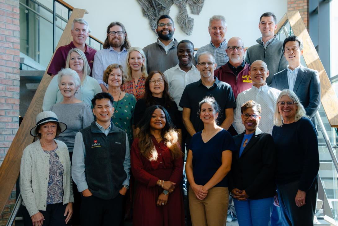 Photo of Calvin Alumni Association board members in front of a white wall