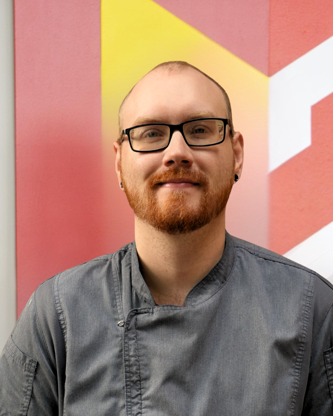 Photo of Kyle Redmond in front of Calvin logo. 