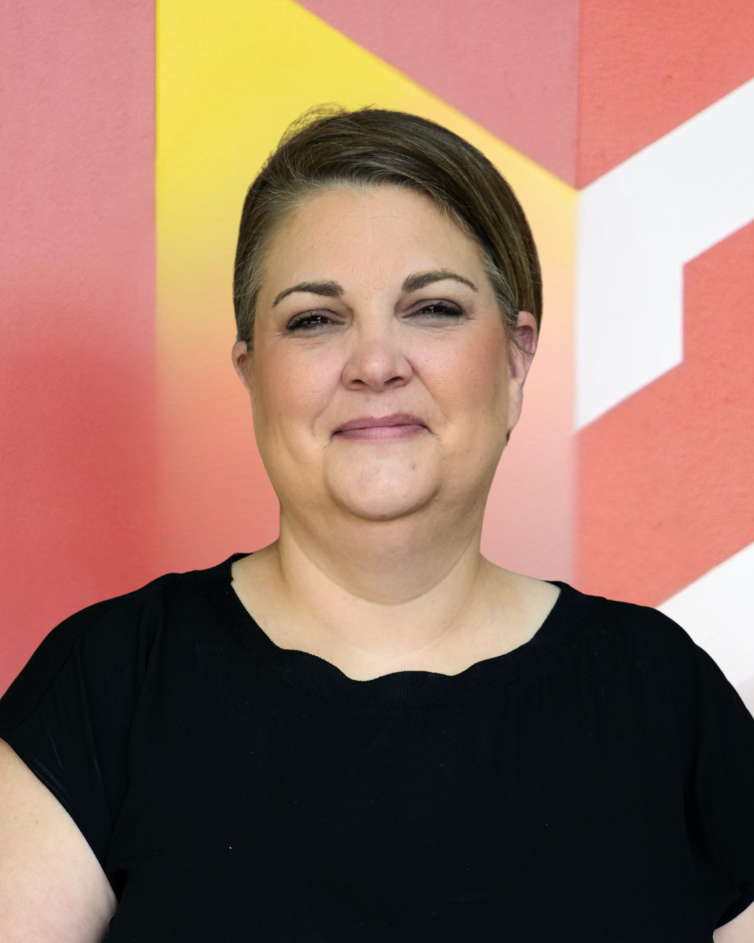 Photo of Heather Mendez in front of Calvin logo.