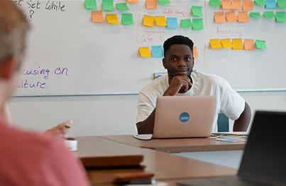 Student in front of a whiteboard