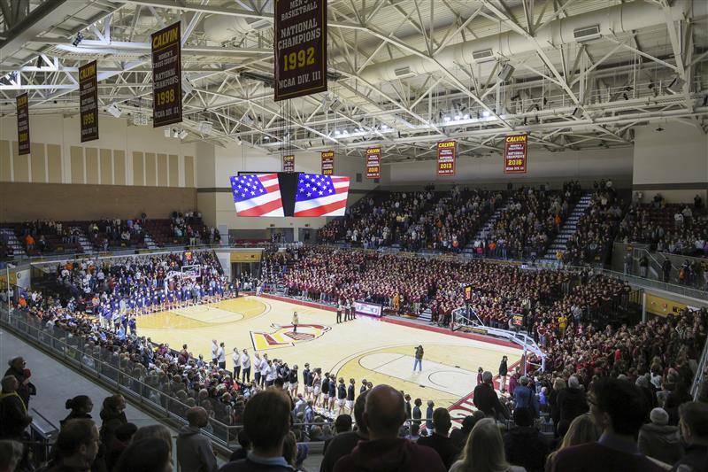Teams and fans stand for the national anthem at the Van Noord arena.